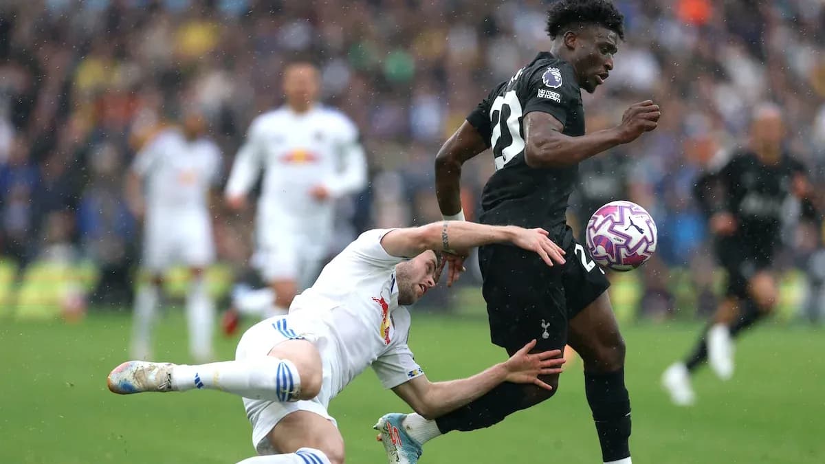Player tackled while dribbling the ball during match Player tackled while dribbling the ball during match