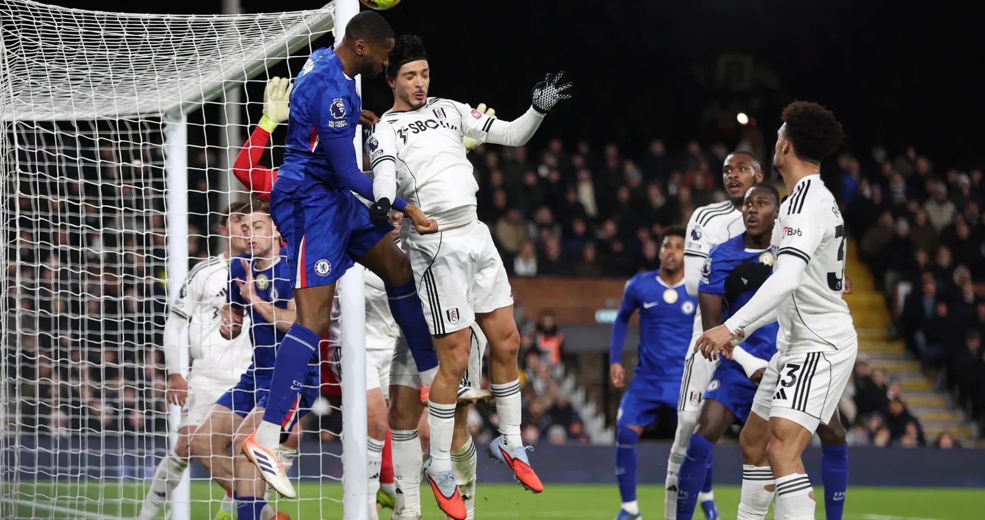 Chelsea player attempting a header in match Chelsea player attempting a header in match