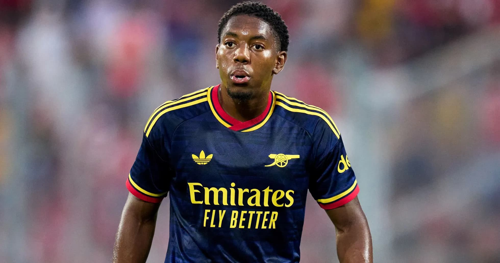 Player in Arsenal kit during match action Player in Arsenal kit during match action