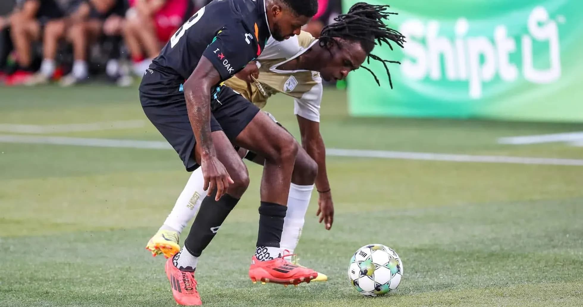 Players competing for the ball in USL match Players competing for the ball in USL match