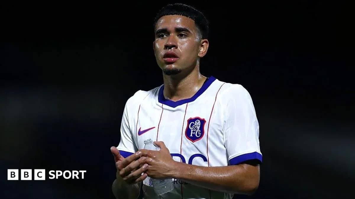 Player in Chelsea FC kit holding water bottle Player in Chelsea FC kit holding water bottle