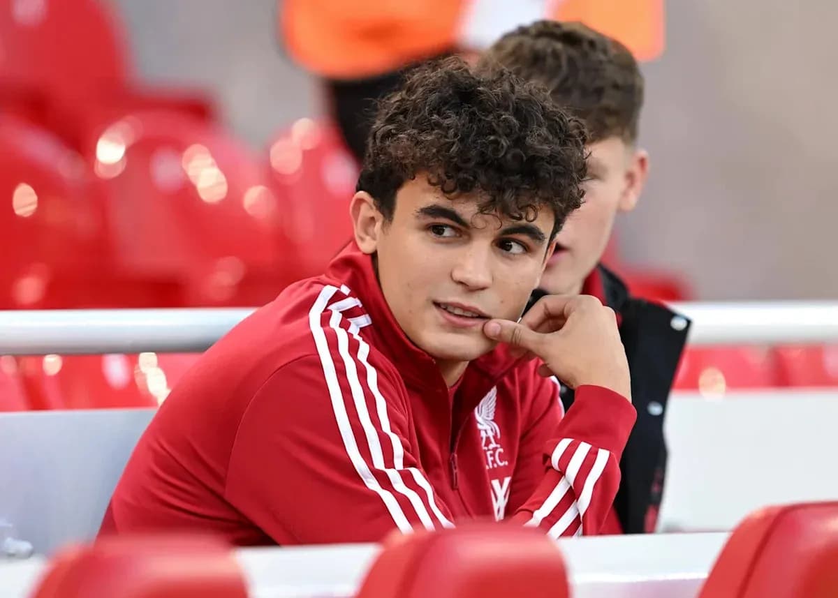 Liverpool player sitting on the bench during match Liverpool player sitting on the bench during match