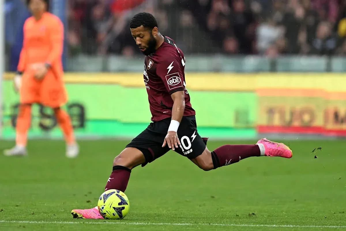 Player kicking a soccer ball during match action Player kicking a soccer ball during match action