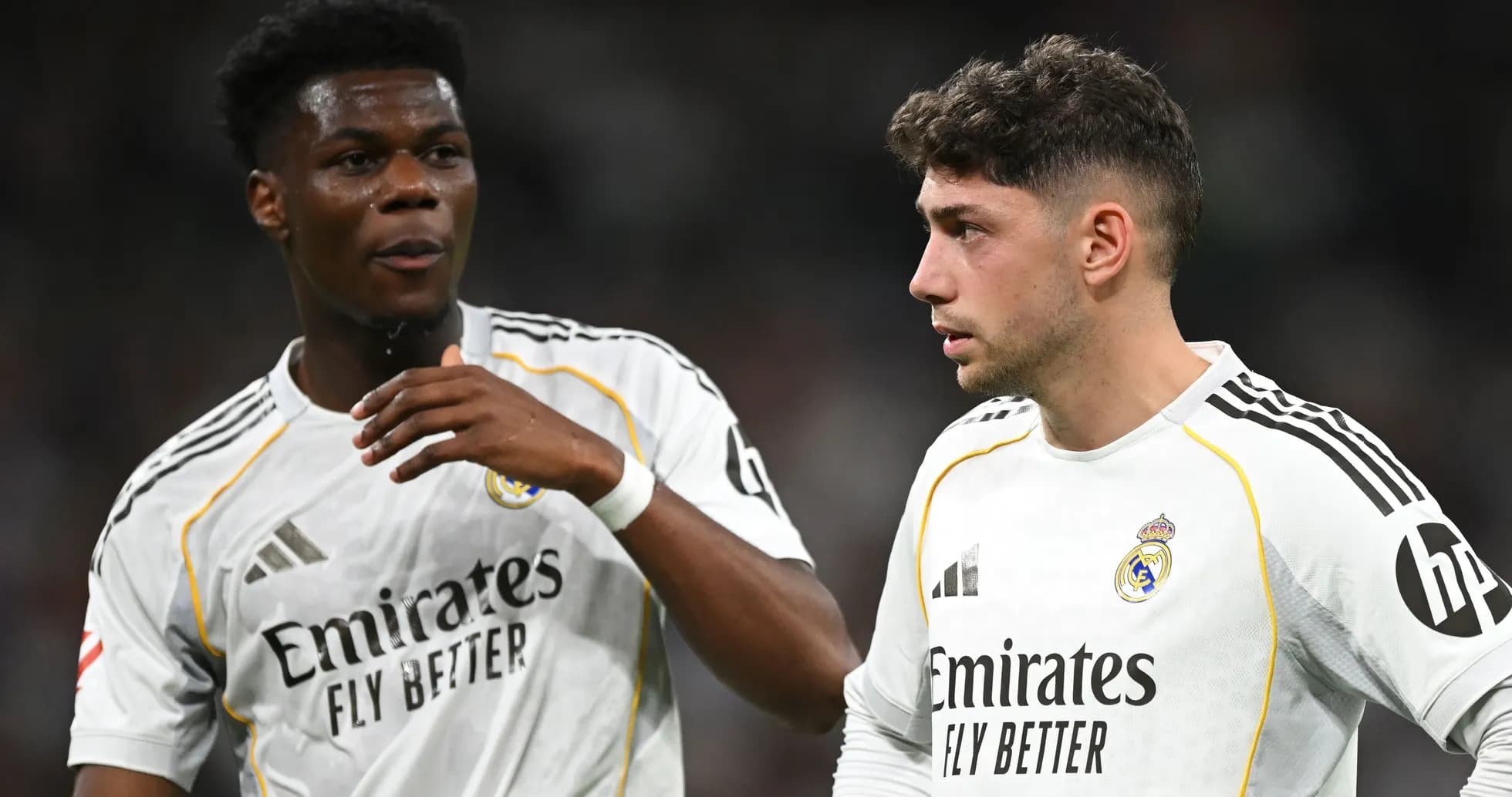 Two Real Madrid players discussing on the field Two Real Madrid players discussing on the field