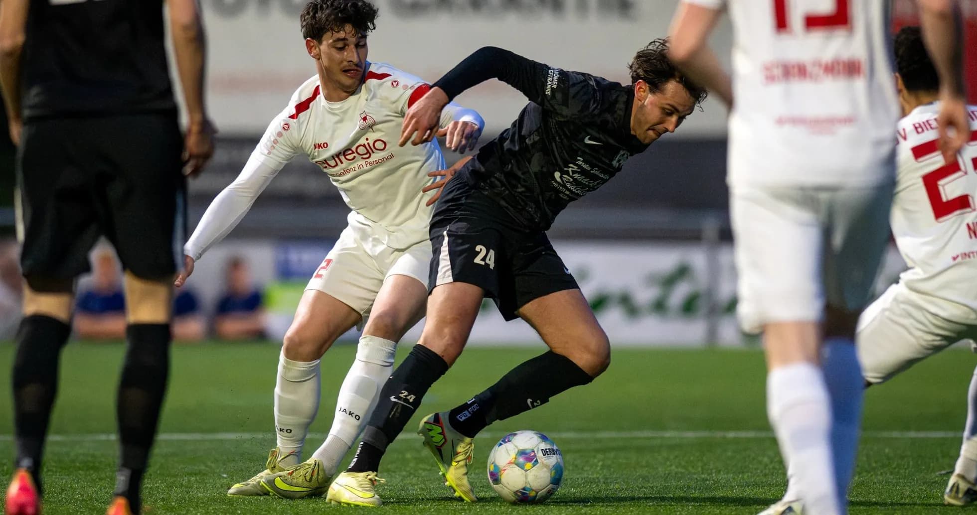 Players battling for possession during match Players battling for possession during match