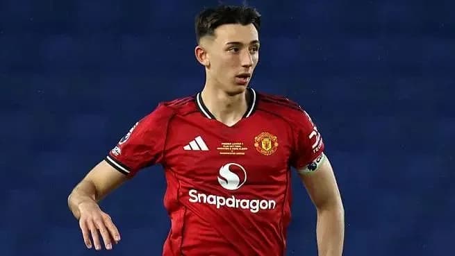 Player in Manchester United kit on the pitch Player in Manchester United kit on the pitch