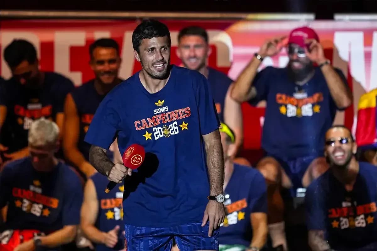 Player celebrating on stage with teammates Player celebrating on stage with teammates