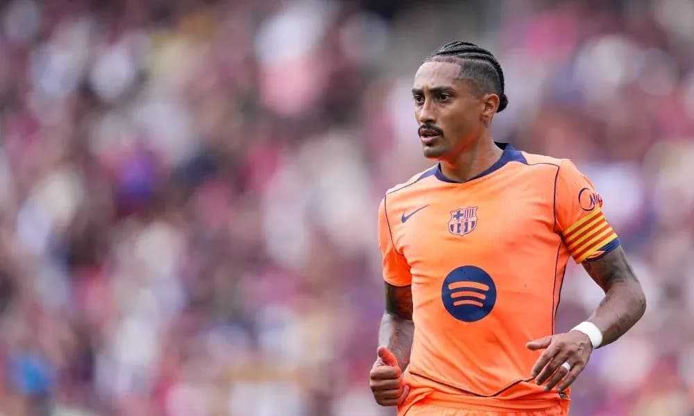 Player in orange Barcelona kit during match Player in orange Barcelona kit during match
