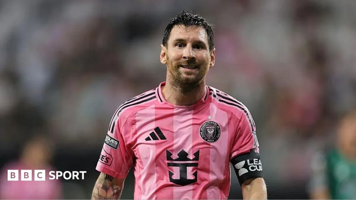 Lionel Messi in pink Inter Miami jersey on field Lionel Messi in pink Inter Miami jersey on field