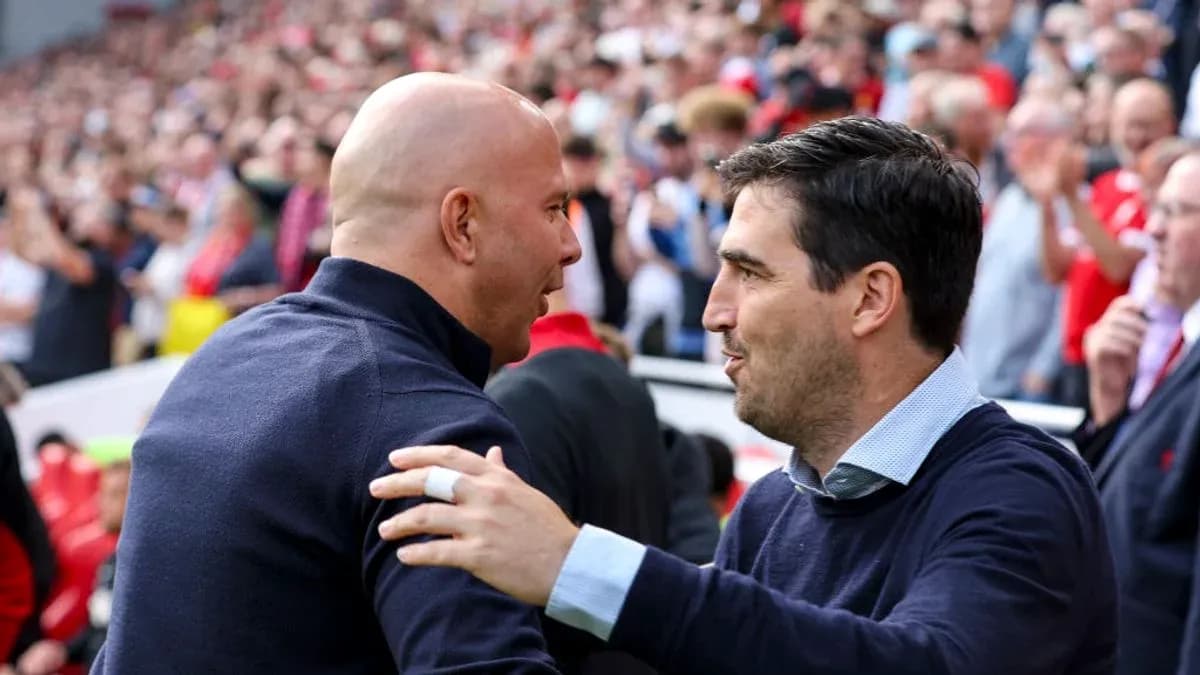 Two coaches greeting each other before the match Two coaches greeting each other before the match