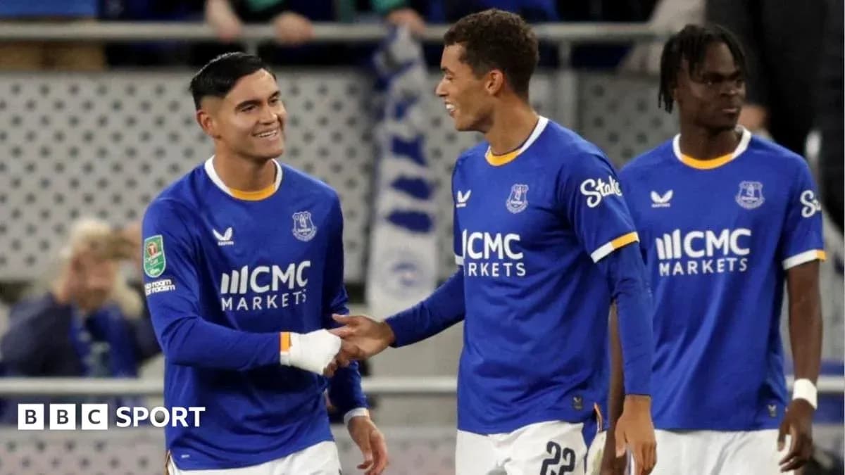 Two Everton players celebrating during a match Two Everton players celebrating during a match