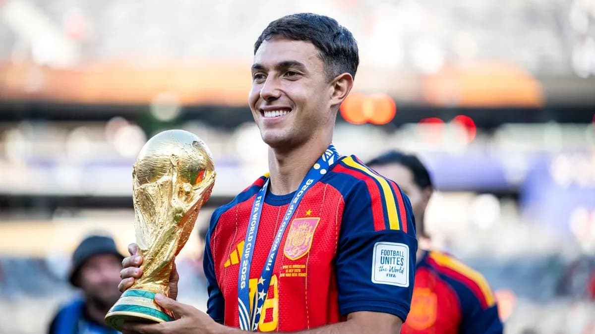Player holding FIFA World Cup trophy in celebration Player holding FIFA World Cup trophy in celebration