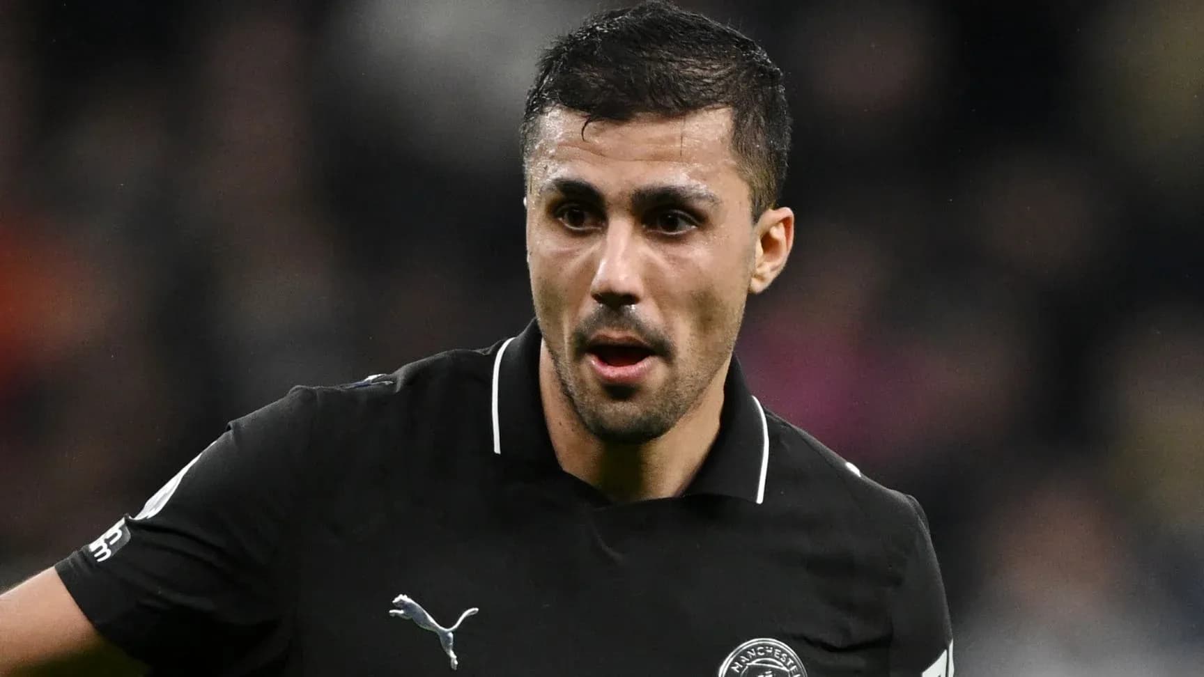 Player wearing black jersey during a match Player wearing black jersey during a match