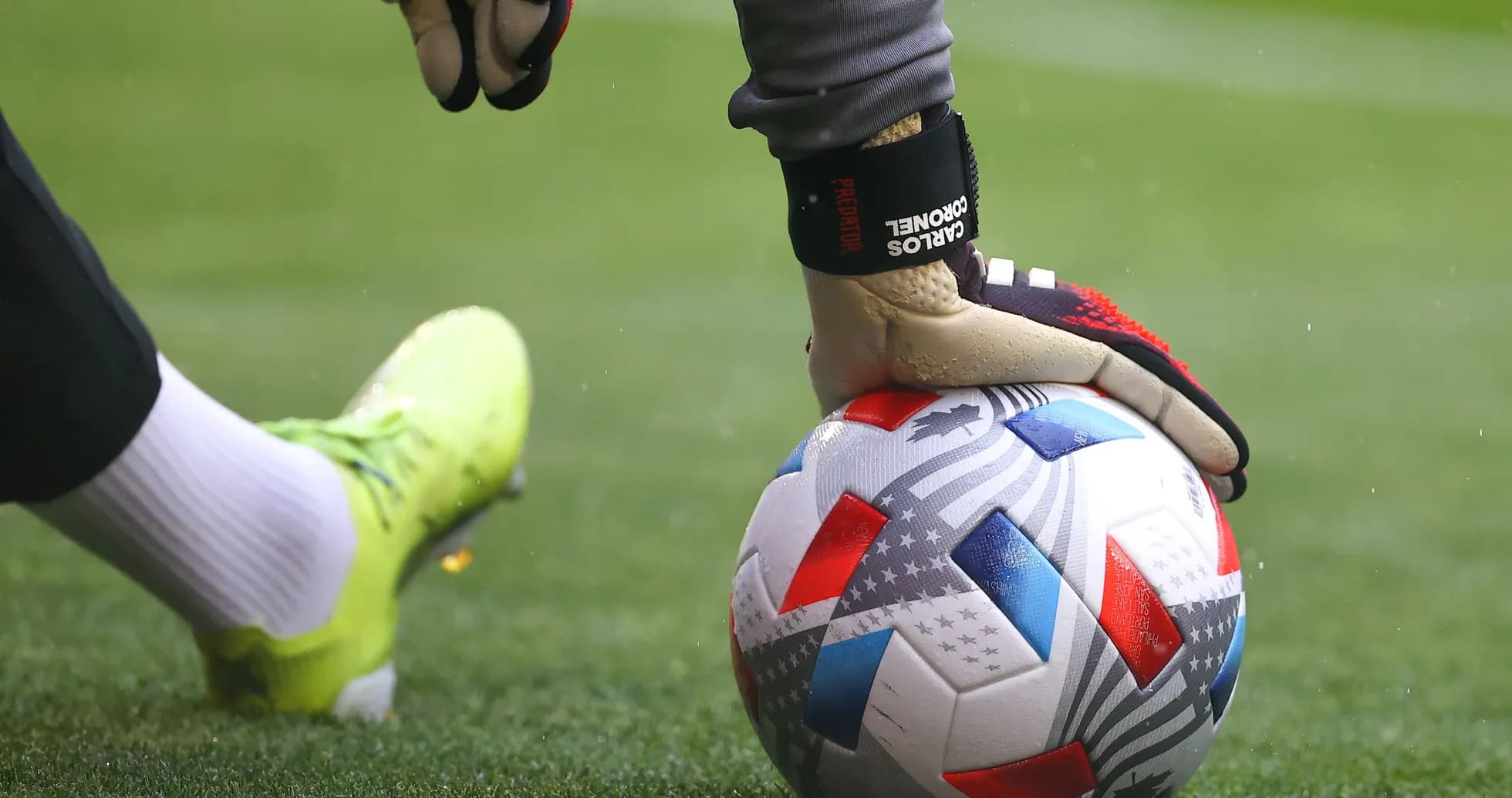 Goalkeeper placing ball on pitch before play Goalkeeper placing ball on pitch before play