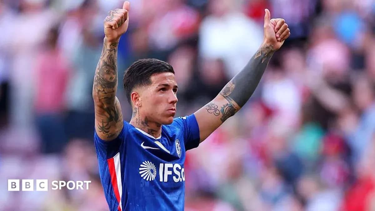 Player celebrating with thumbs up in stadium Player celebrating with thumbs up in stadium
