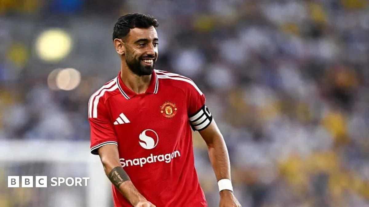 Bruno Fernandes smiling in Manchester United kit Bruno Fernandes smiling in Manchester United kit