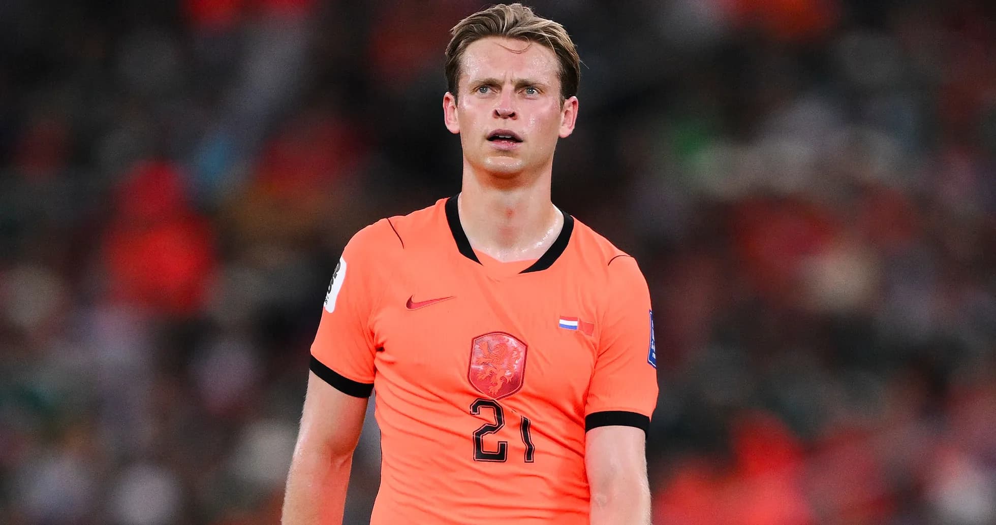 Player in orange jersey during a match Player in orange jersey during a match