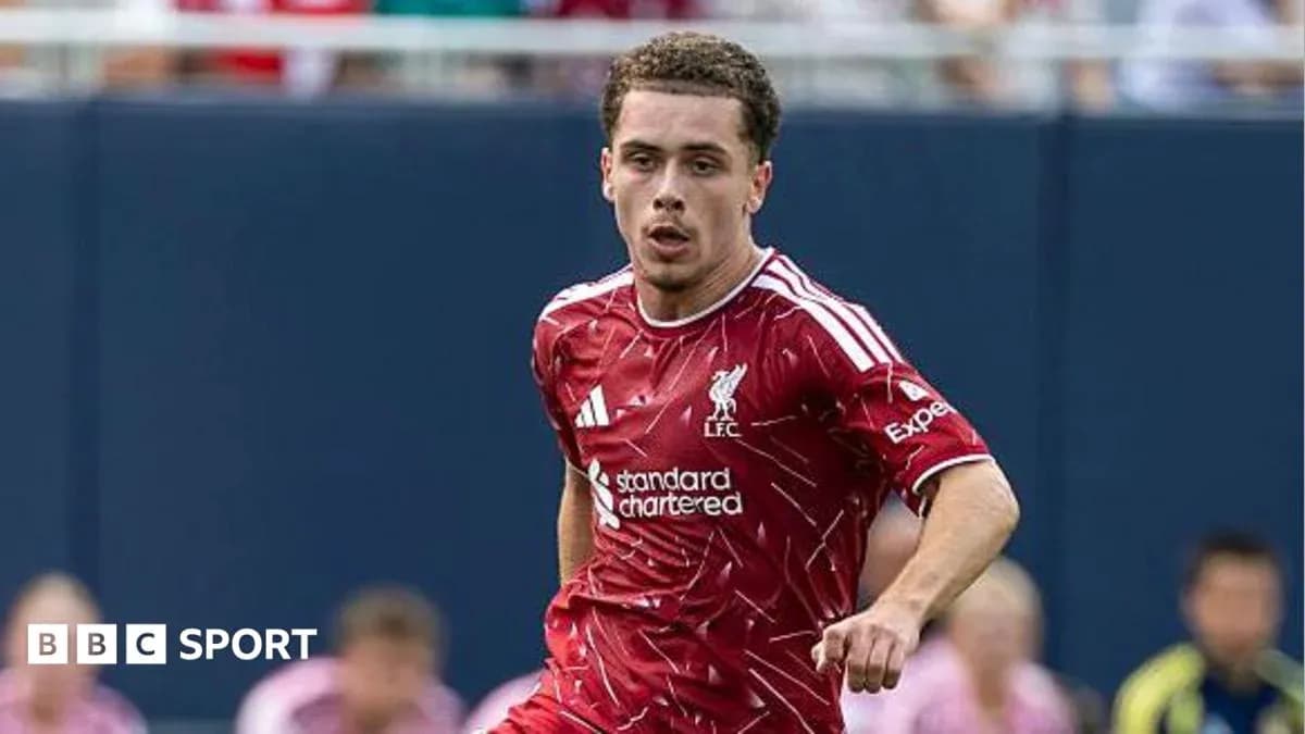 Player running during Liverpool FC match Player running during Liverpool FC match