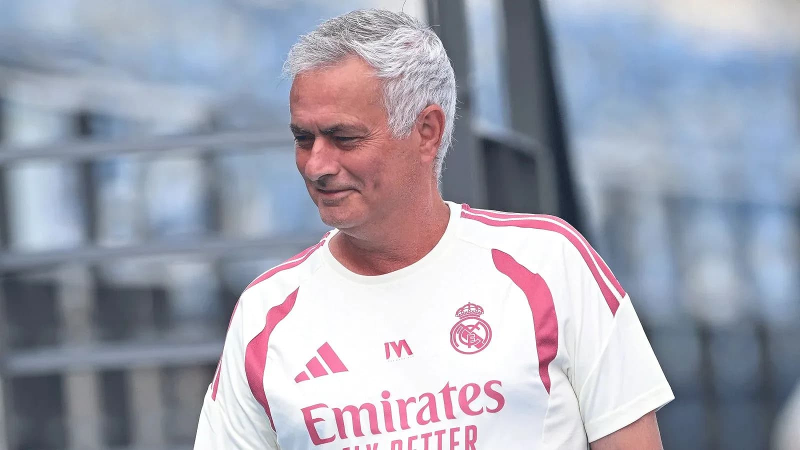 Manager wearing Real Madrid training kit on pitch Manager wearing Real Madrid training kit on pitch