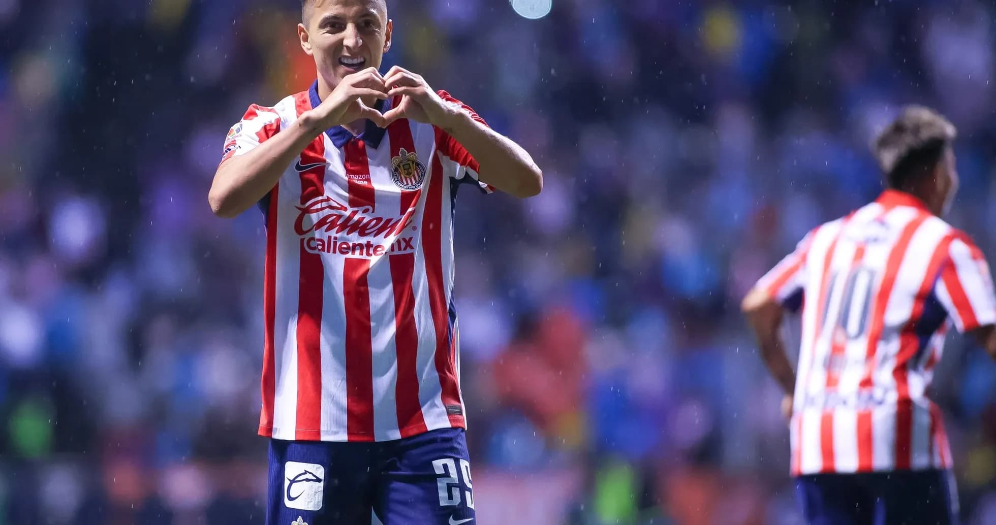 Player celebrating goal for Guadalajara Chivas Player celebrating goal for Guadalajara Chivas