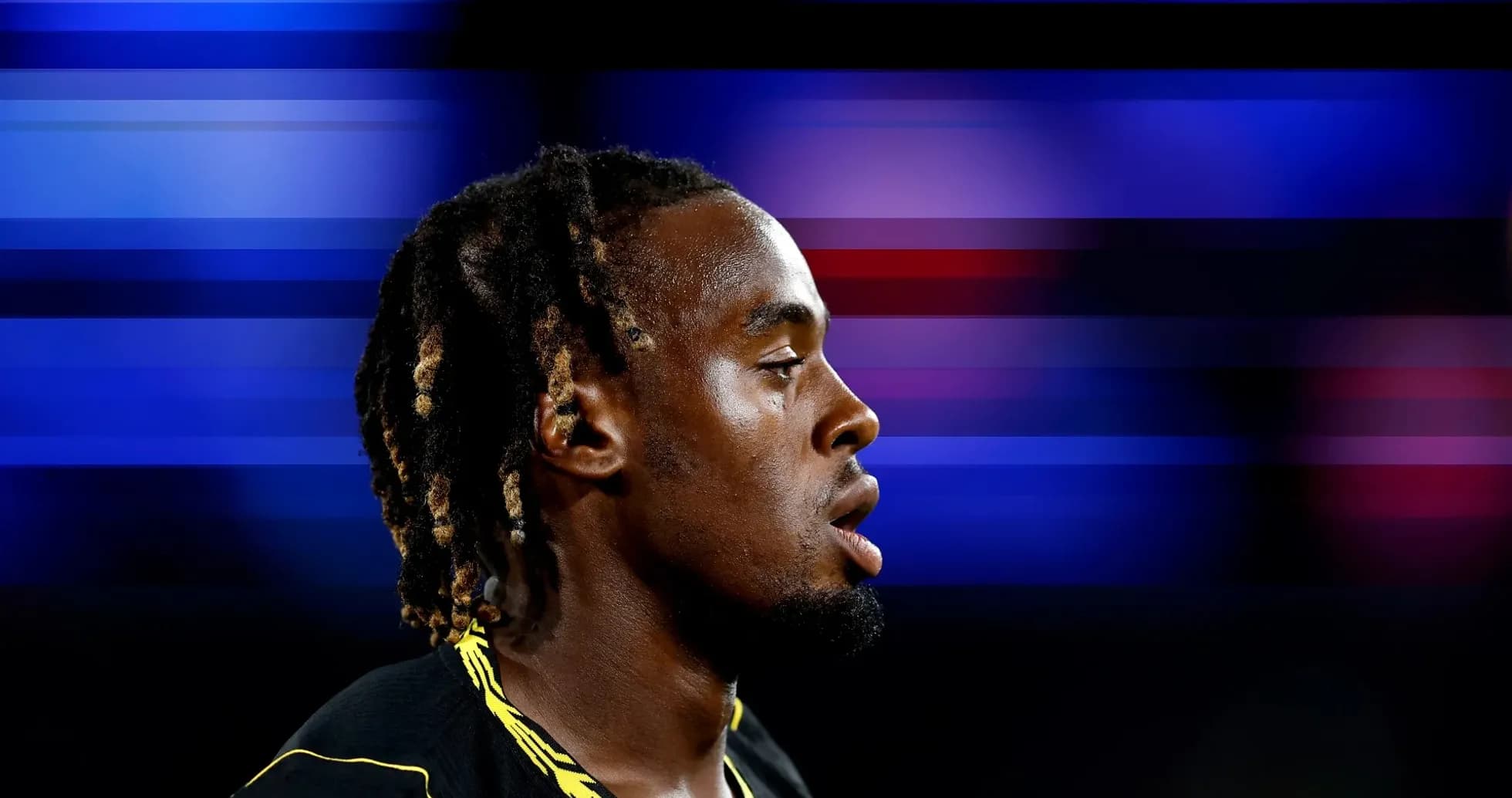 Athlete with braided hair in profile view Athlete with braided hair in profile view