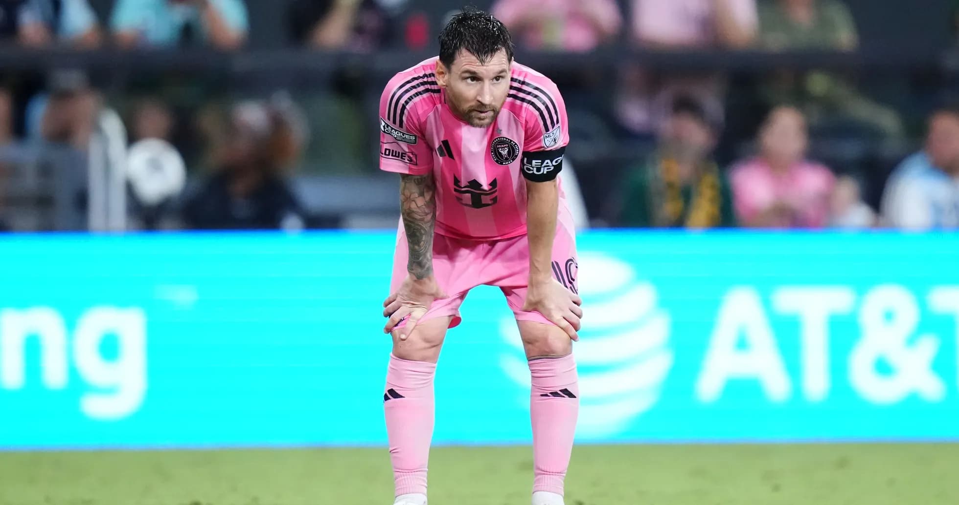 Player in pink jersey resting during match Player in pink jersey resting during match
