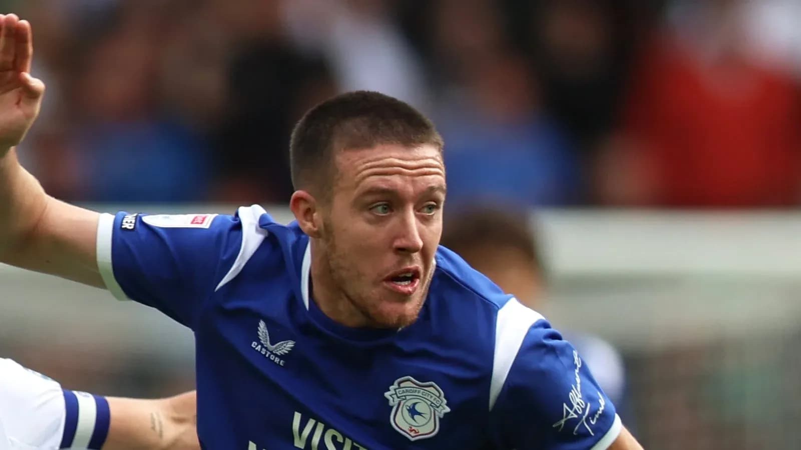 Player in blue jersey running during football match Player in blue jersey running during football match