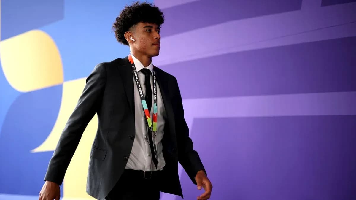 Player walking in formal attire at event Player walking in formal attire at event