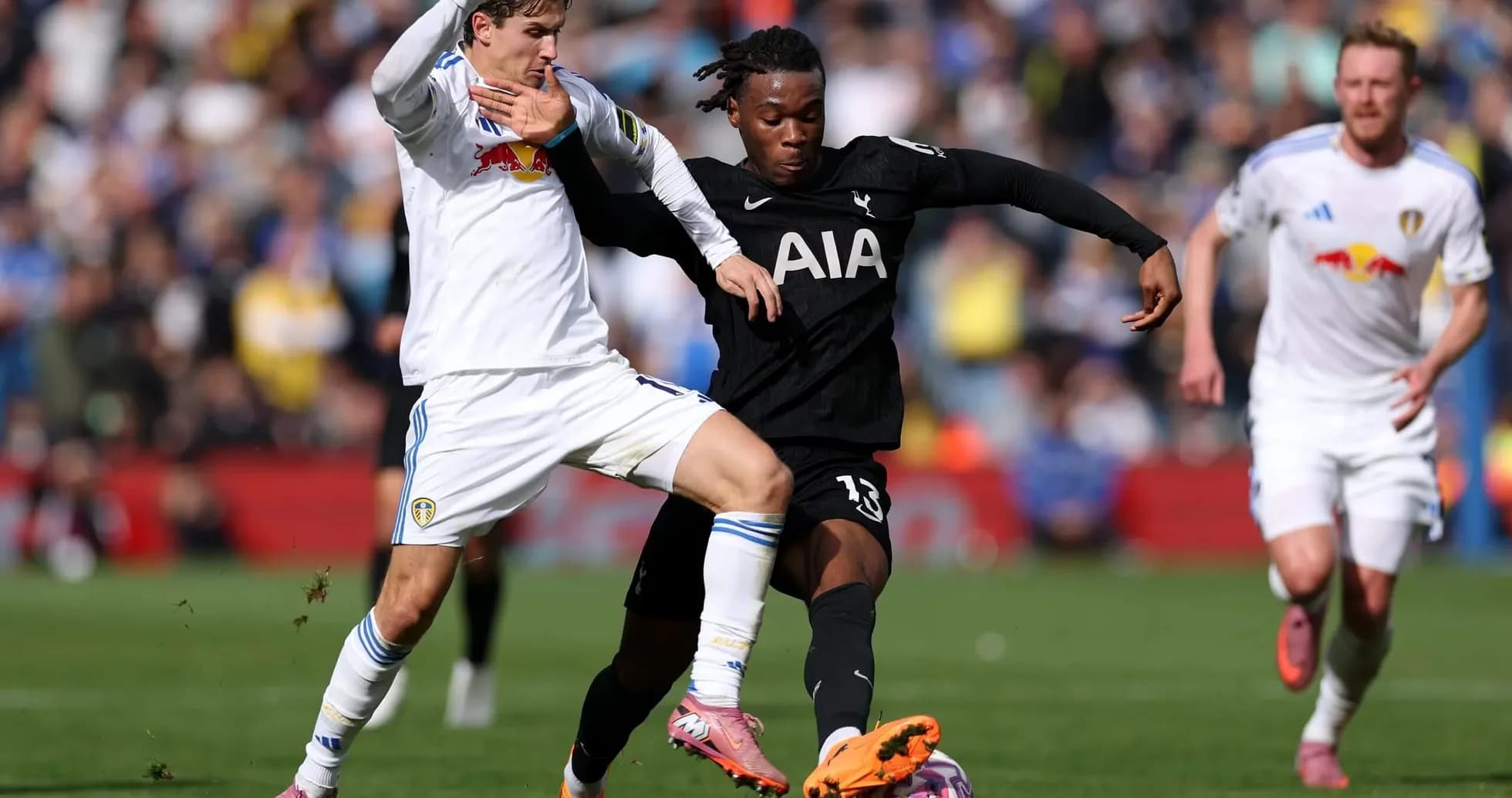 Players challenging for the ball during match Players challenging for the ball during match