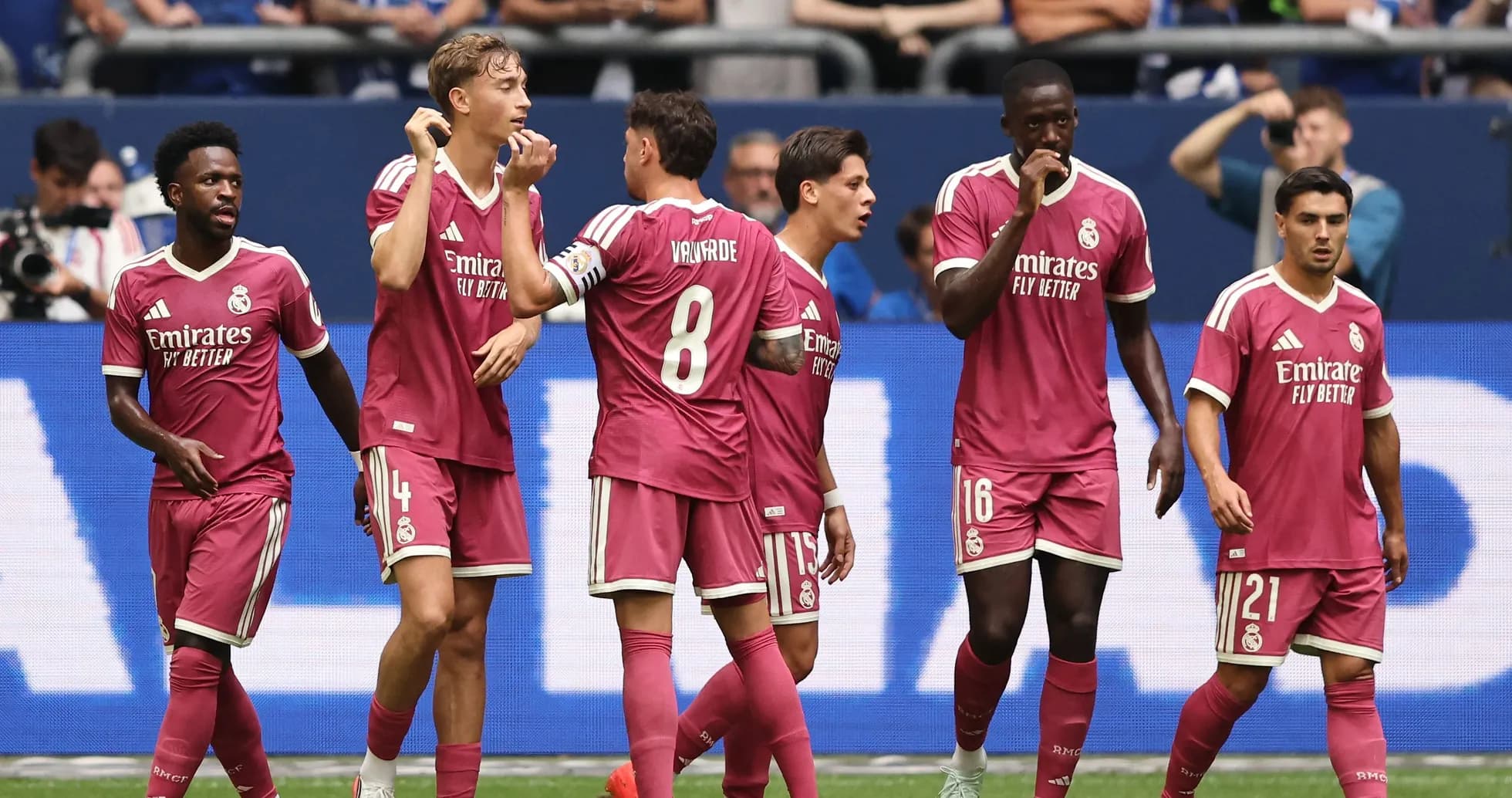 Real Madrid players celebrating a goal together Real Madrid players celebrating a goal together