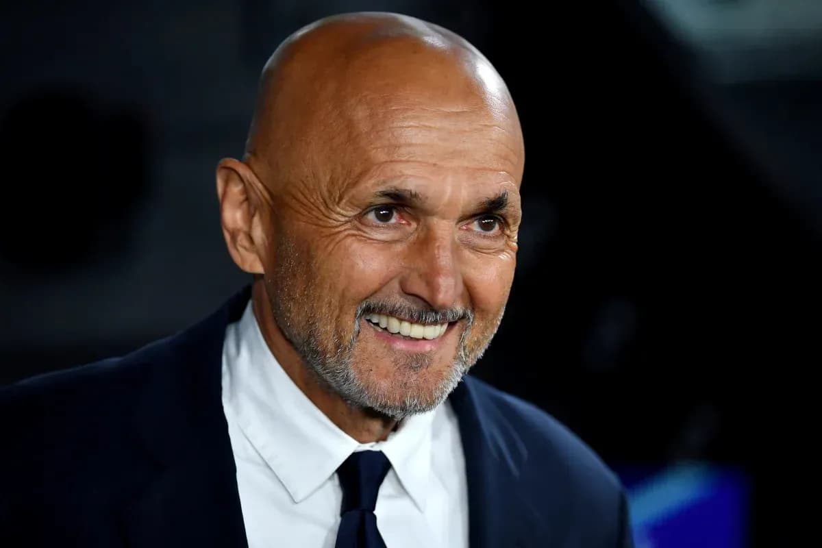 Smiling coach in a suit at an event Smiling coach in a suit at an event