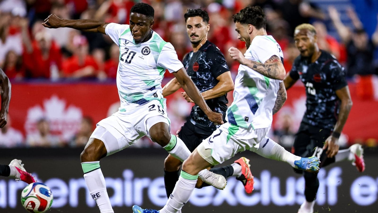 Players competing for the ball during a match Players competing for the ball during a match