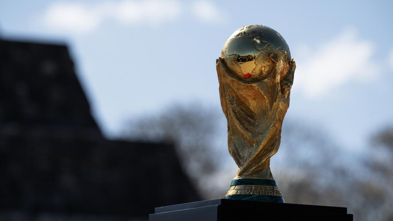 FIFA World Cup trophy against blue sky FIFA World Cup trophy against blue sky