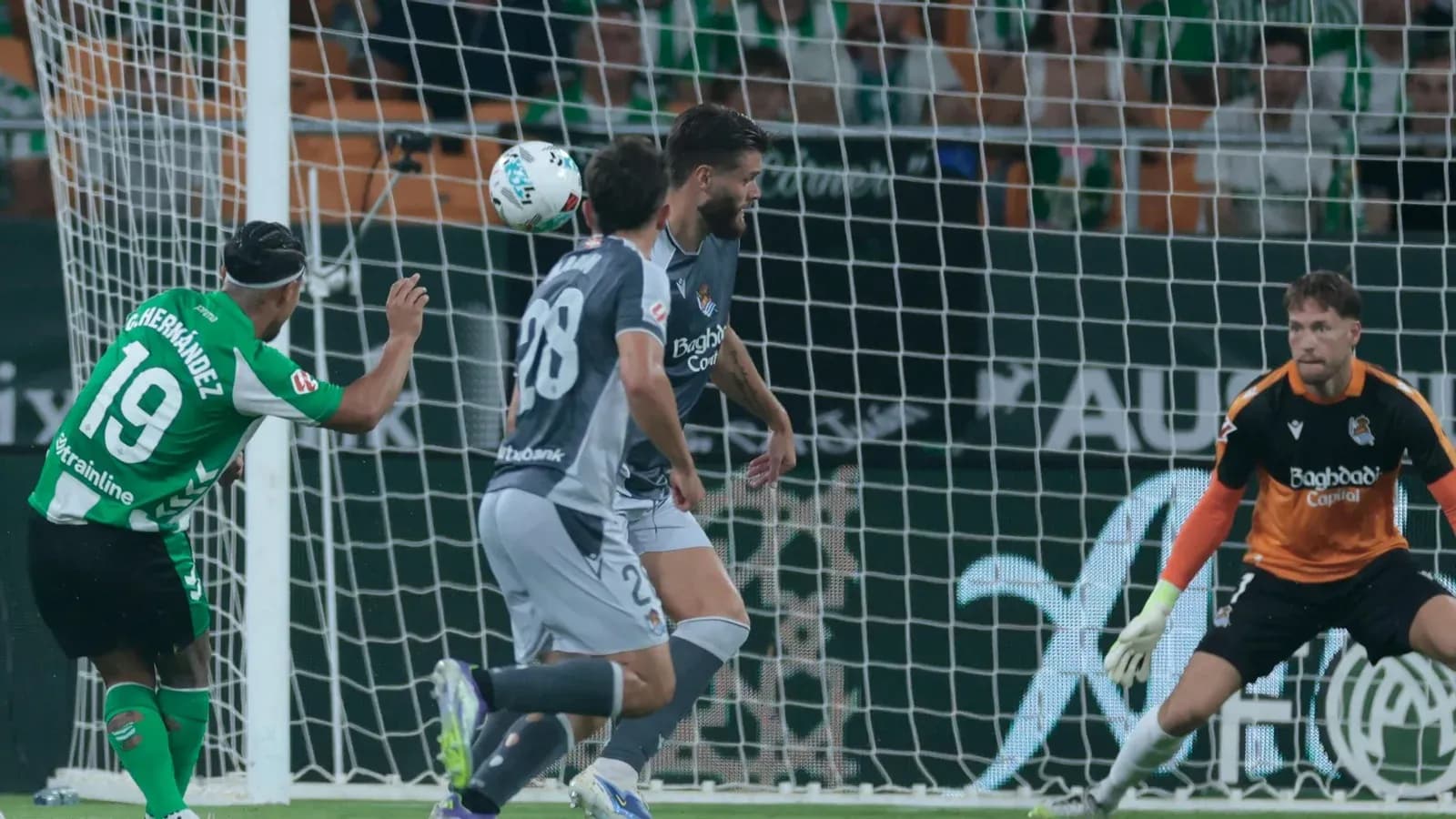Player attempting a header during La Liga match Player attempting a header during La Liga match