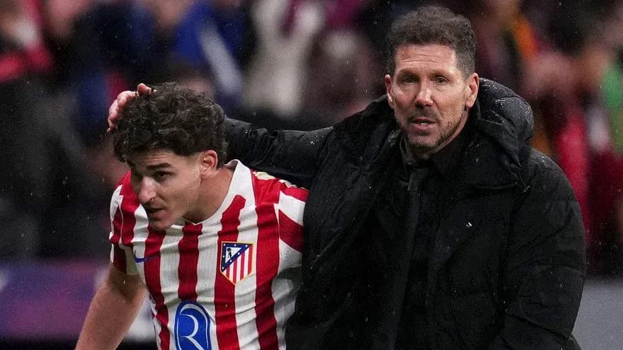 Atletico Madrid player receiving guidance from coach Atletico Madrid player receiving guidance from coach