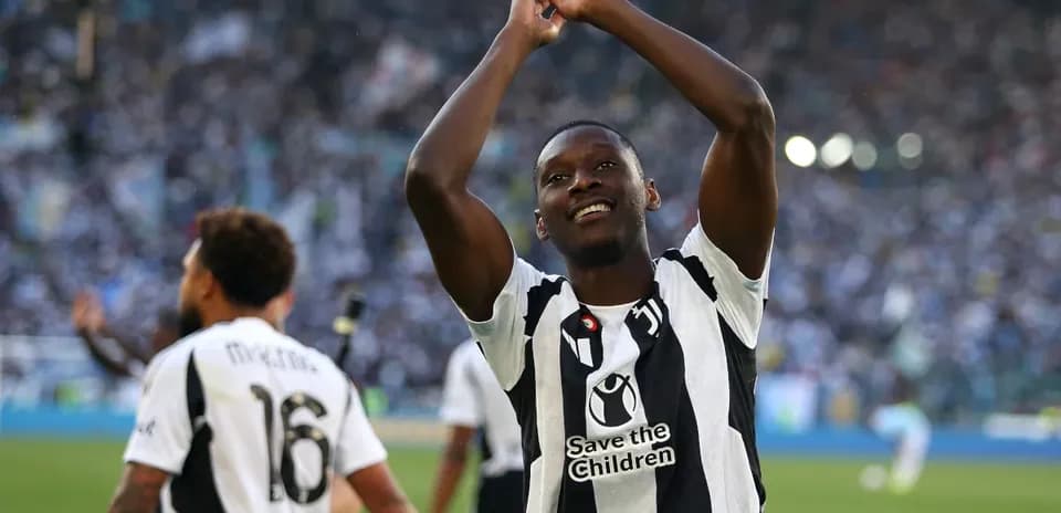 Player celebrating with fans after match victory Player celebrating with fans after match victory