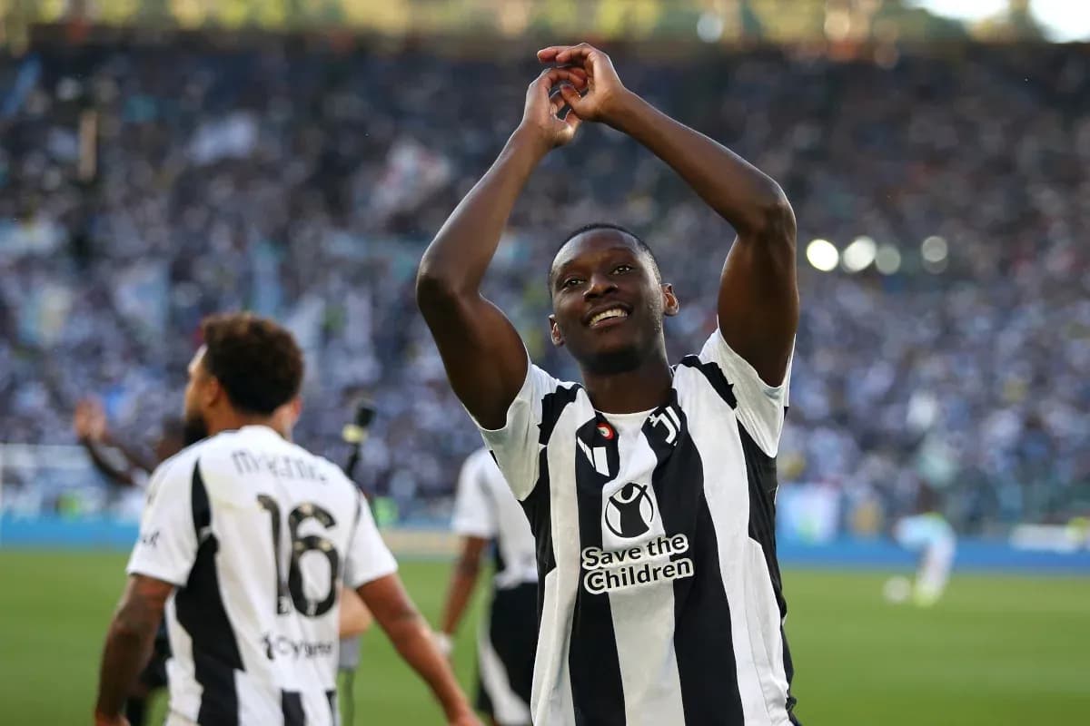 Player celebrating with fans after match victory Player celebrating with fans after match victory