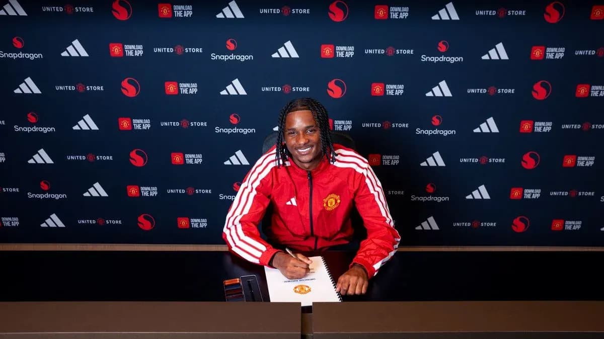 Player signing contract at Manchester United press conference Player signing contract at Manchester United press conference