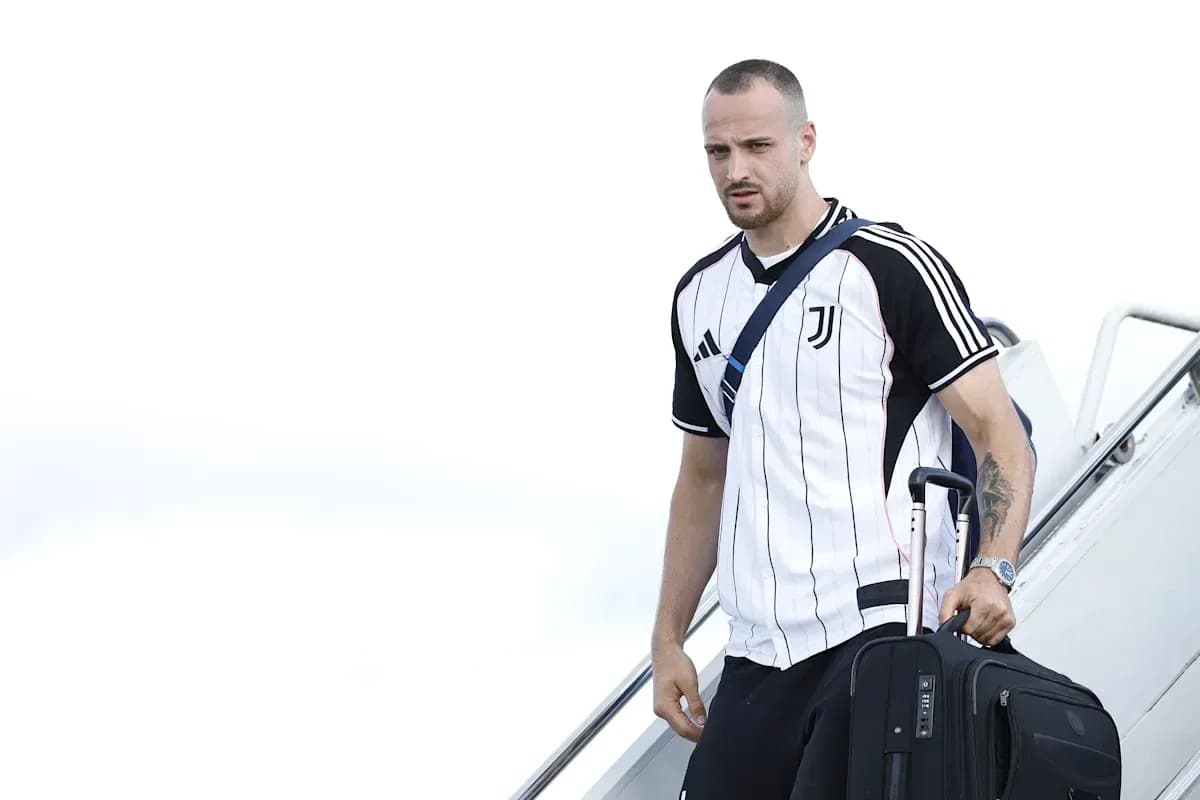 Player arriving with suitcase after disembarking aircraft Player arriving with suitcase after disembarking aircraft