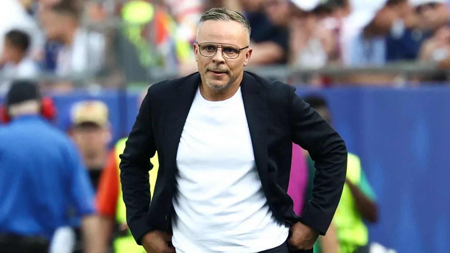 Coach walking on the sideline during a match Coach walking on the sideline during a match