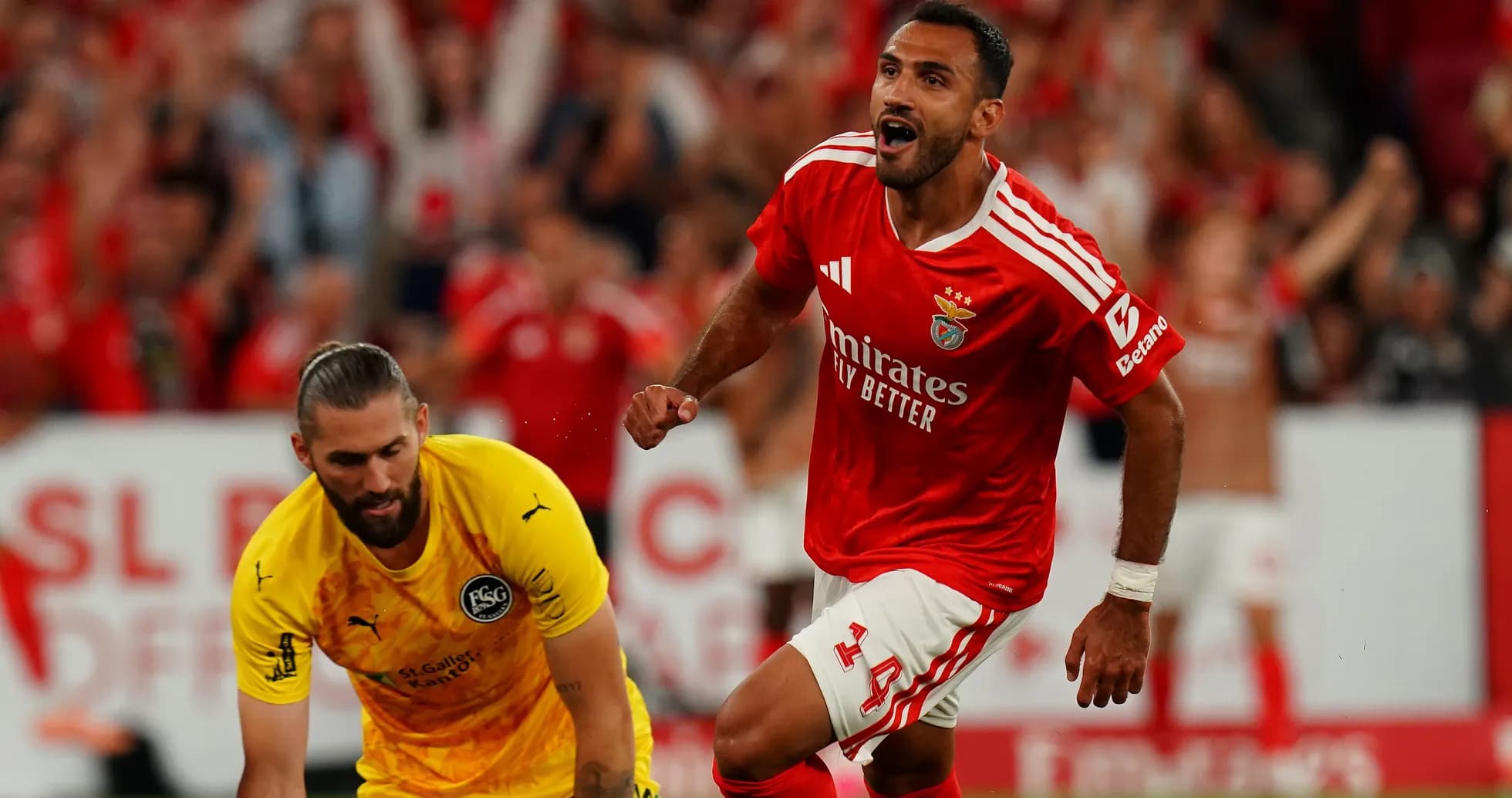 Benfica player celebrating a goal against goalkeeper Benfica player celebrating a goal against goalkeeper