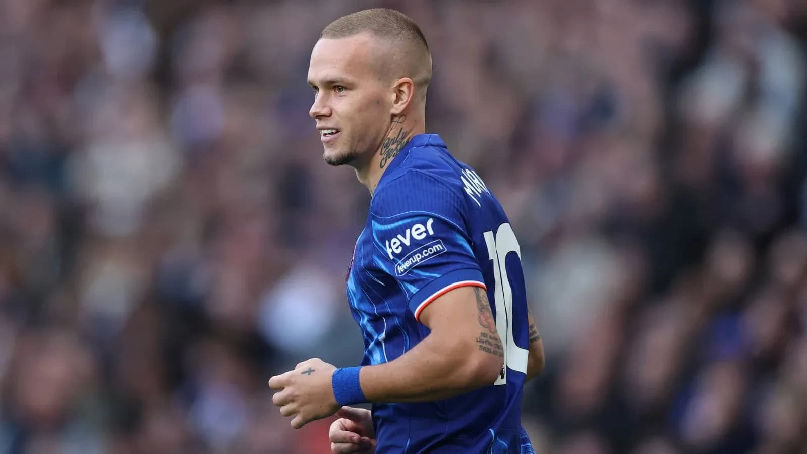 Player in blue jersey during a football match Player in blue jersey during a football match
