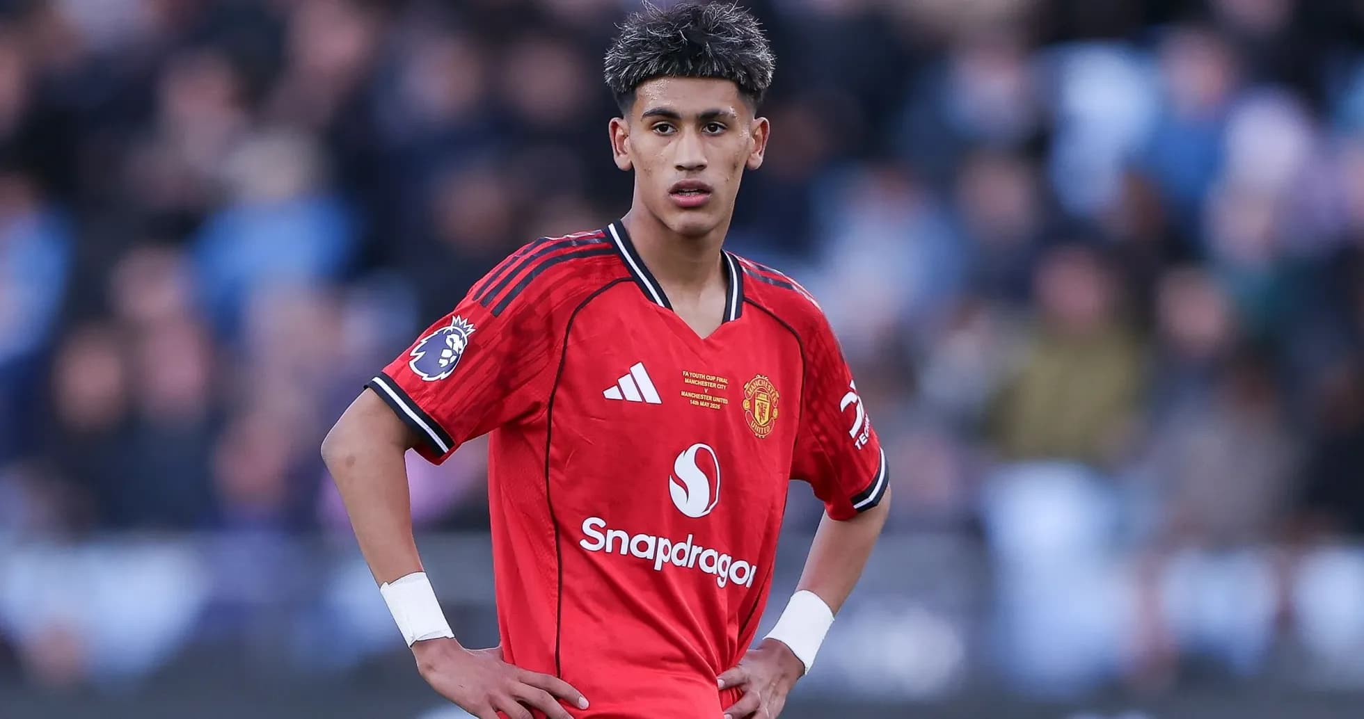 Young player in Manchester United kit during match Young player in Manchester United kit during match
