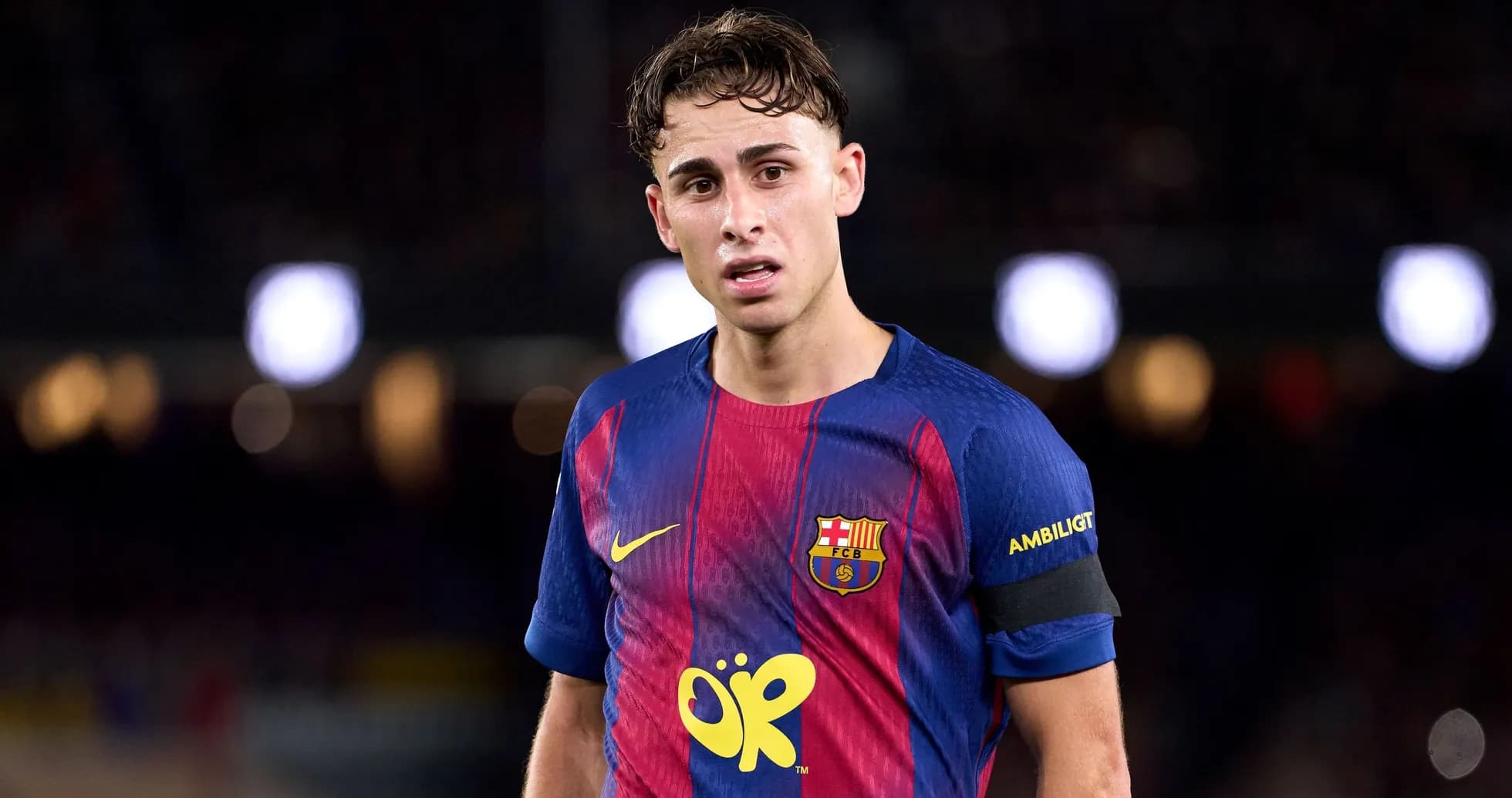 Player wearing FC Barcelona jersey on field Player wearing FC Barcelona jersey on field