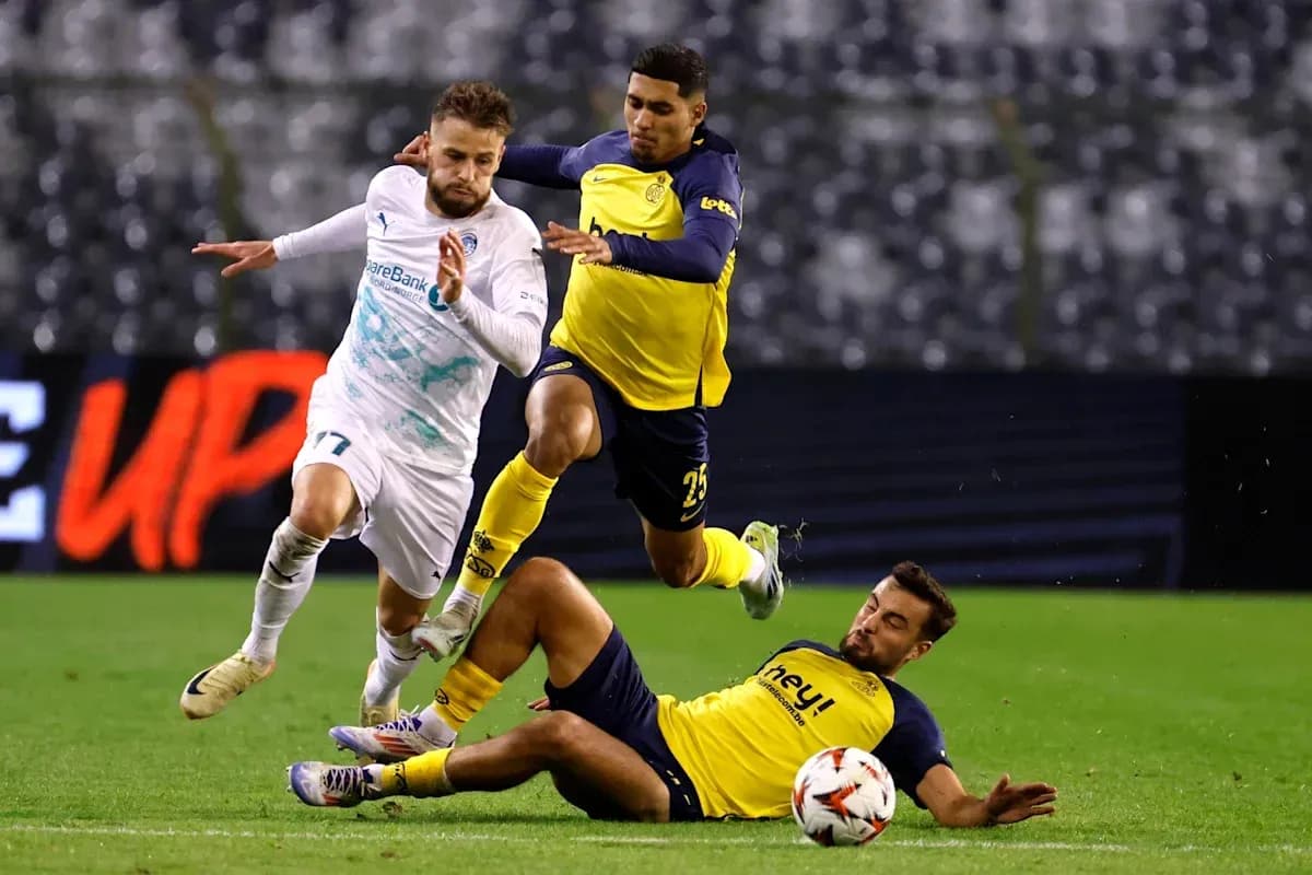 Player evading two defenders during a match Player evading two defenders during a match