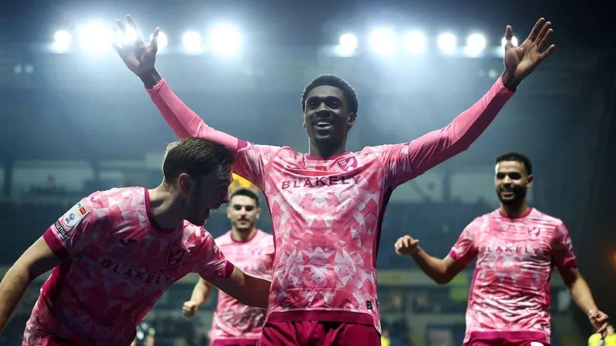 Players celebrating after scoring a goal during match Players celebrating after scoring a goal during match