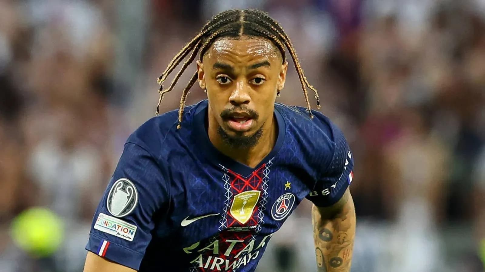 Player in Paris Saint-Germain kit running during match Player in Paris Saint-Germain kit running during match