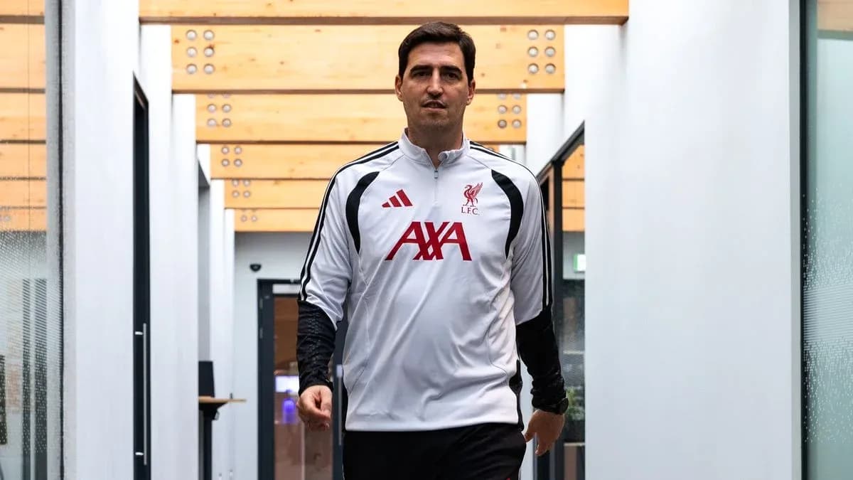 Coach walking through training facility corridor Coach walking through training facility corridor