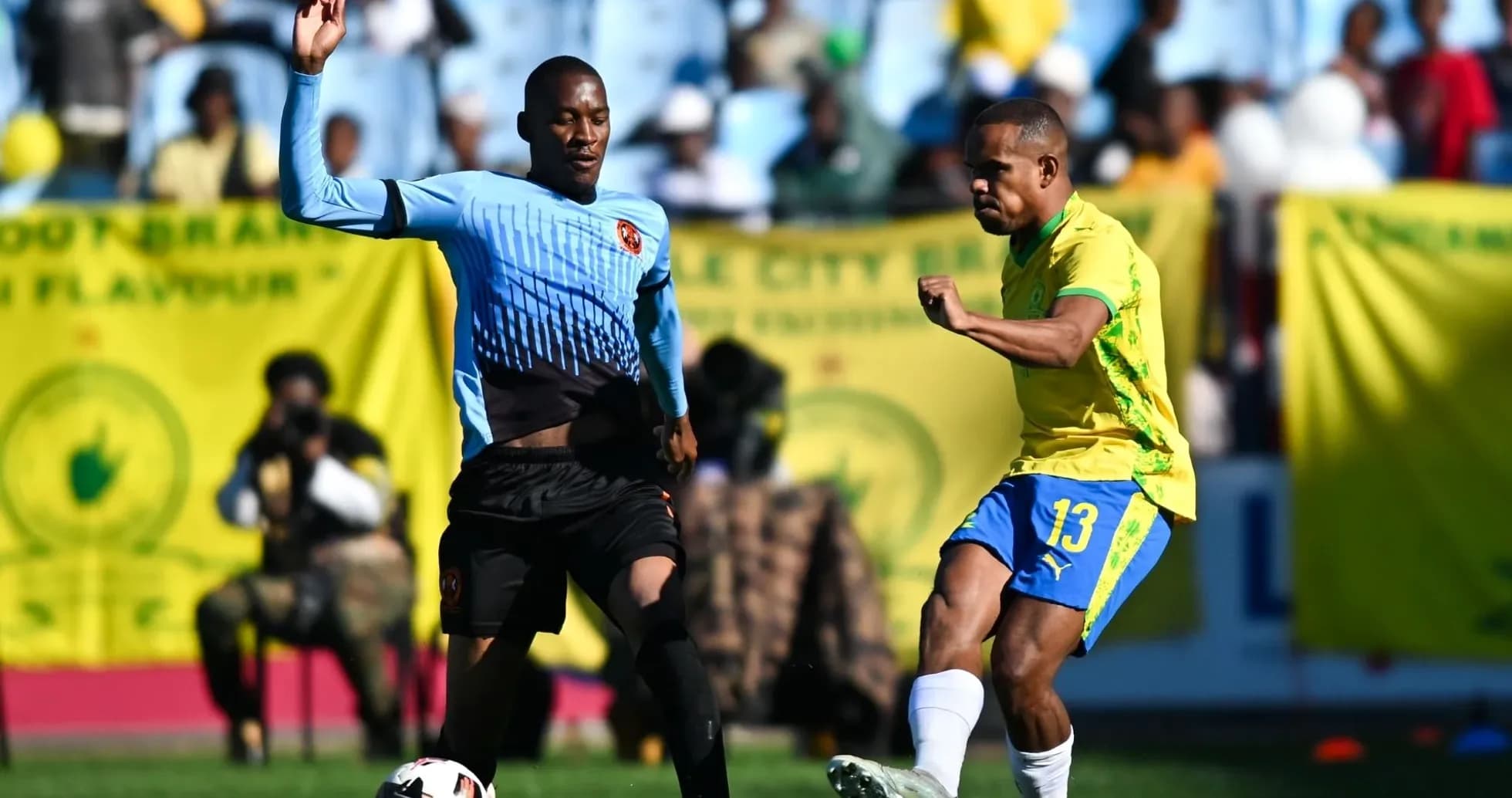 Player dribbling past opponent during football match Player dribbling past opponent during football match