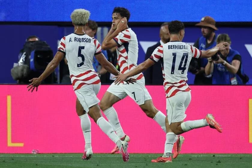 Players celebrating a goal during a match Players celebrating a goal during a match